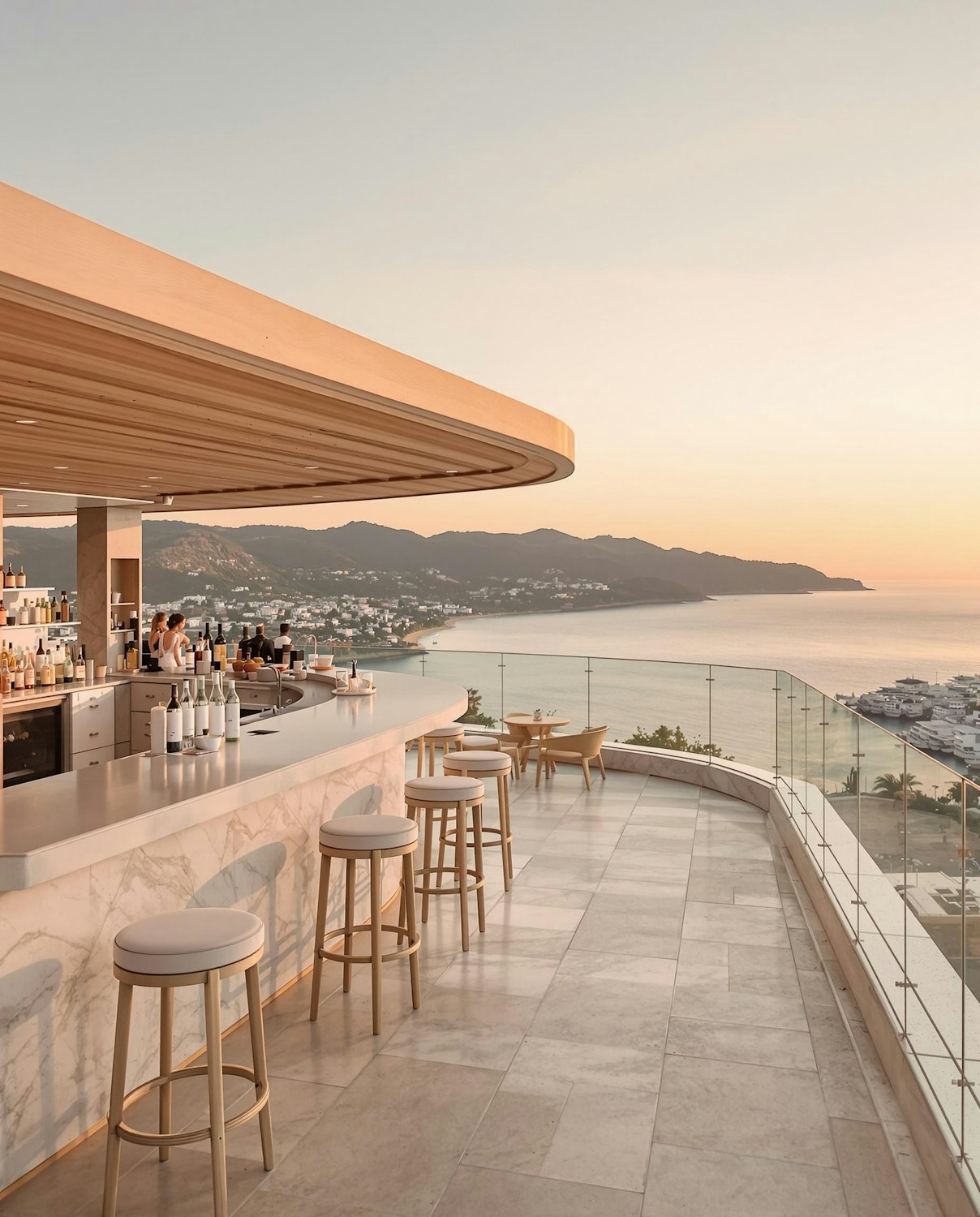 The heated patio at sunset with a long counter and wooden stools